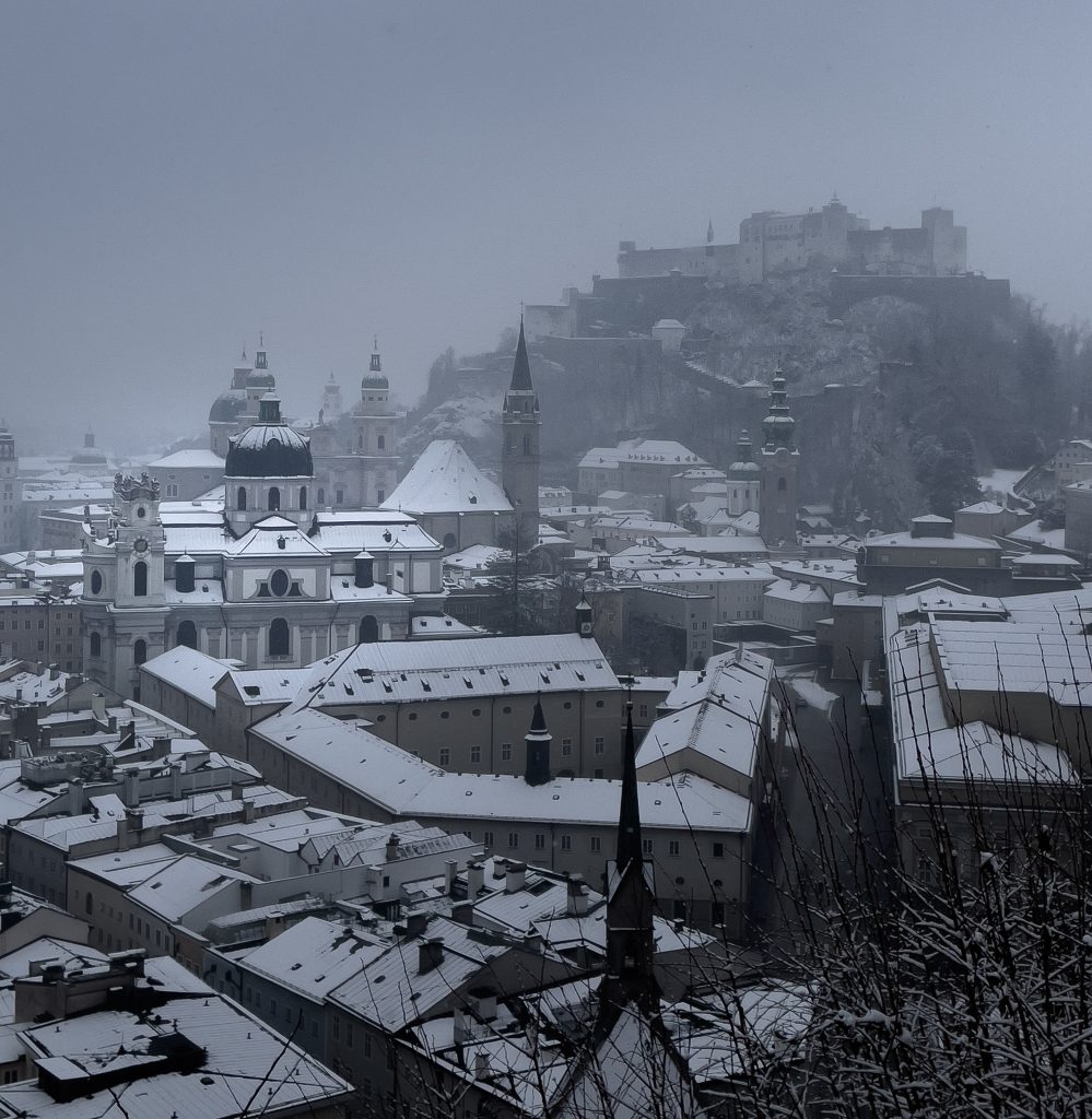 View point over a snow-covered Salzburg city