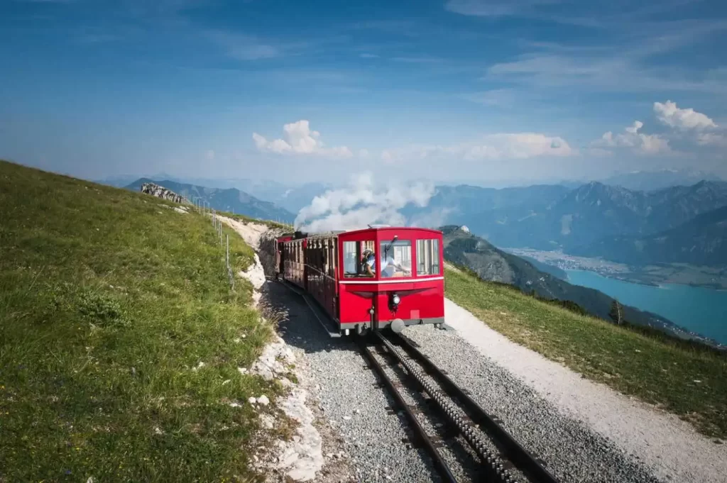 St Wolfgang funicular view of a red cable car ascending a steep Austrian mountain