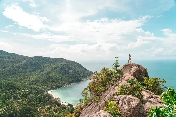 Girl standing on a lookout point at Bottle Beach, one of the best beaches on Koh Phangan