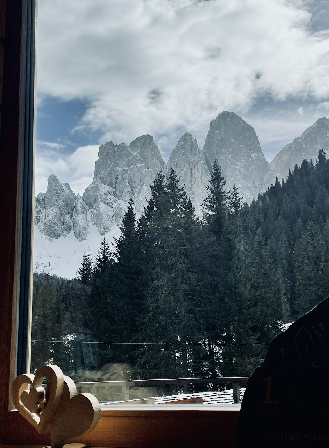 Seceda mountains in the Dolomites through a restaurant window