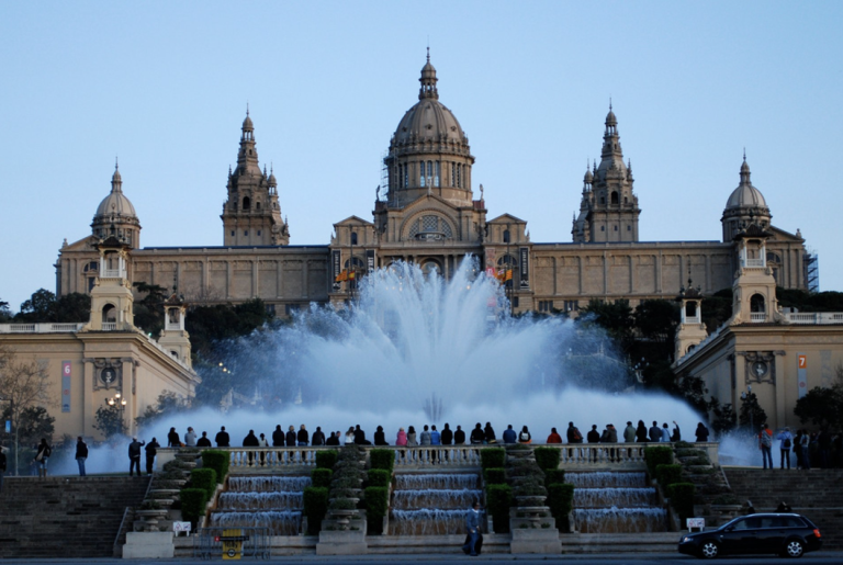 Large Montjuic water fountain erupting in front of the National Art Museum of Catalonia in Barcelona, Spain